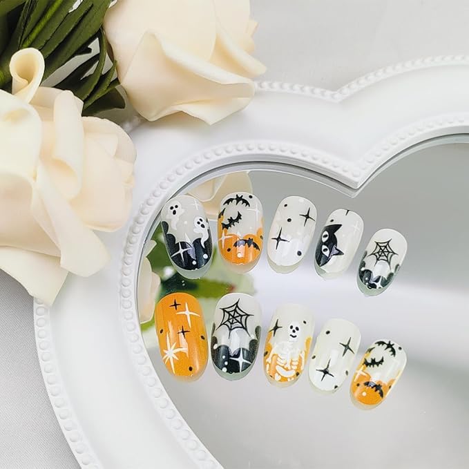 24Pcs Halloween French Tip Press on Nails Short Oval False Nail with Bat Ghost Spider Web Black Cat Skeleton Design Glue on Nails Stars Acrylic Nail Orange Black Full Cover Stick on Nails for Women