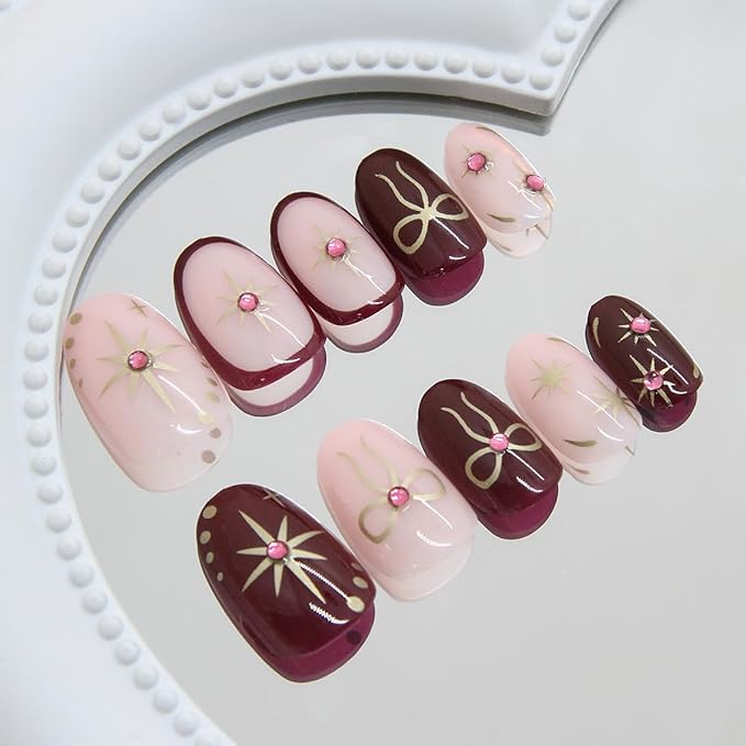 24Pcs Heart Press on Nails Medium Almond Fake Nails with Gilding Bow Star Design Glossy False Nails Nude Stick on Nails Full Cover Artificial Glue on Nails Cute Nail Supplies for Women Reusable DIY