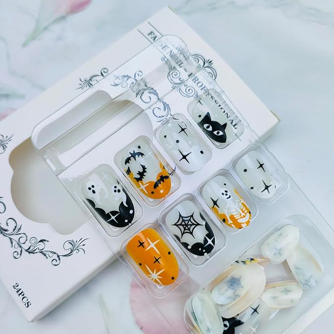 24Pcs Halloween French Tip Press on Nails Short Oval False Nail with Bat Ghost Spider Web Black Cat Skeleton Design Glue on Nails Stars Acrylic Nail Orange Black Full Cover Stick on Nails for Women