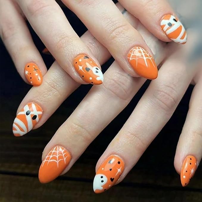 24Pcs Halloween Press on Nails Short Fake Nails Glossy Orange False Nails with Cute Ghost Spider Web Mummy Design Full Cover Artificial Glue on Nails Star Heart Stick on Nail for Women Acrylic Nail