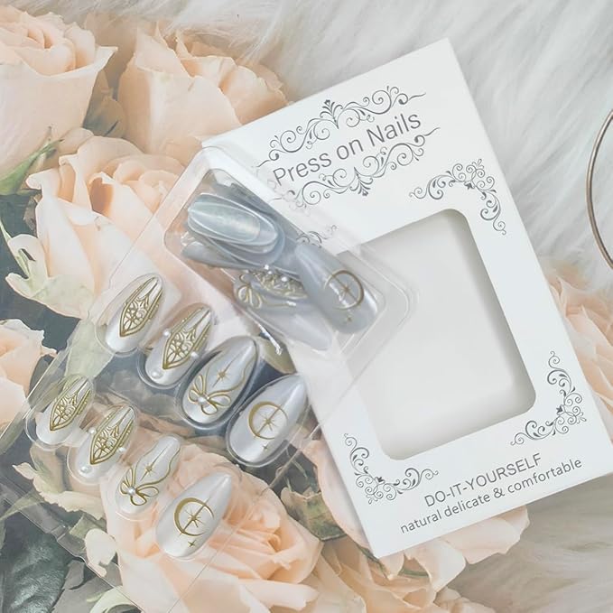 24Pcs Almond Press on Nails Medium Fake Nails Glossy Nude White Glue on Nails with Pearl Design Gold Chrome Bow Star Moon False Nail Full Cover Glitter Artificial Stick on Nails for Women Acrylic Nail