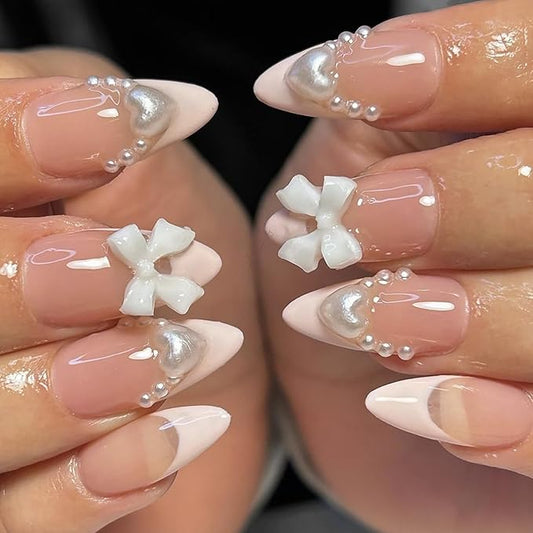 24Pcs White French Tip Press on Nails Medium Almond Fake Nails with Glitter Heart Nail Charms Acrylic Nails Cute Pearls Bow Full Cover False Nails Nude Pink Glue on Nails for Women DIY Stick on Nails