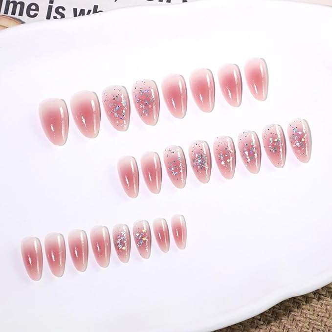 Cute Pink Glitter Press On Nails Almond Shape – Medium Length Nude Gradient Acrylic Fake Nails with Iridescent Hearts & Confetti, 24Pcs Glossy Stick On Nails Kit with Glue for Girls & Women Party
