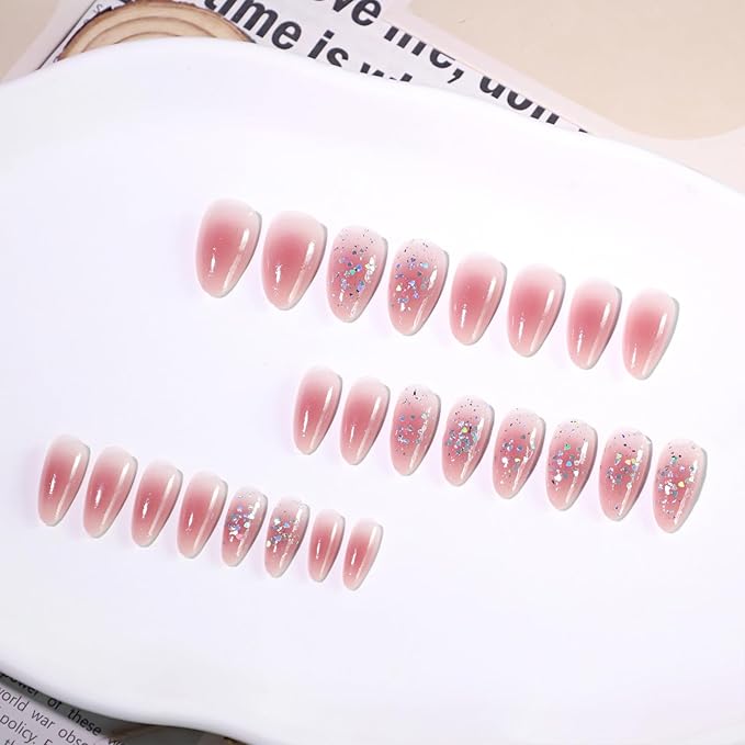 Cute Pink Glitter Press On Nails Almond Shape – Medium Length Nude Gradient Acrylic Fake Nails with Iridescent Hearts & Confetti, 24Pcs Glossy Stick On Nails Kit with Glue for Girls & Women Party