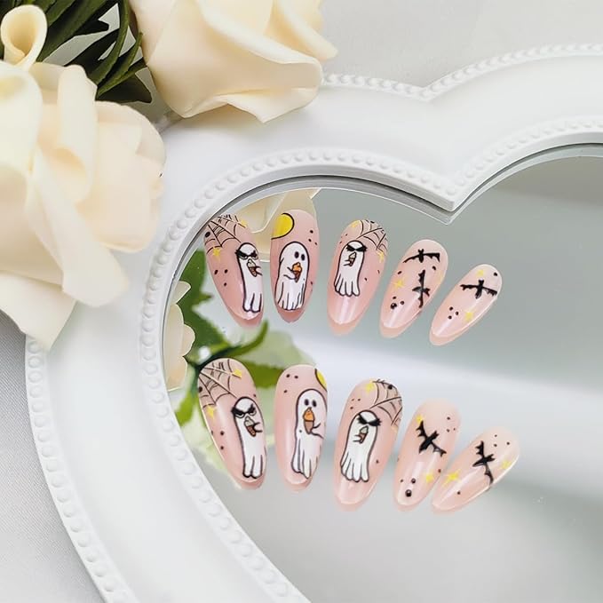24Pcs Halloween Ghost Press on Nails Medium Almond Fake Nails with Stars Bat Spider Web Designs Glue on Nail Glossy Nude Acrylic Nail Halloween Full Cover Stick on Nails for Women DIY Manicure Salon