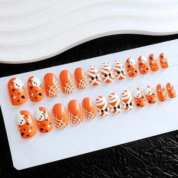 24Pcs Halloween Press on Nails Short Fake Nails Glossy Orange False Nails with Cute Ghost Spider Web Mummy Design Full Cover Artificial Glue on Nails Star Heart Stick on Nail for Women Acrylic Nail