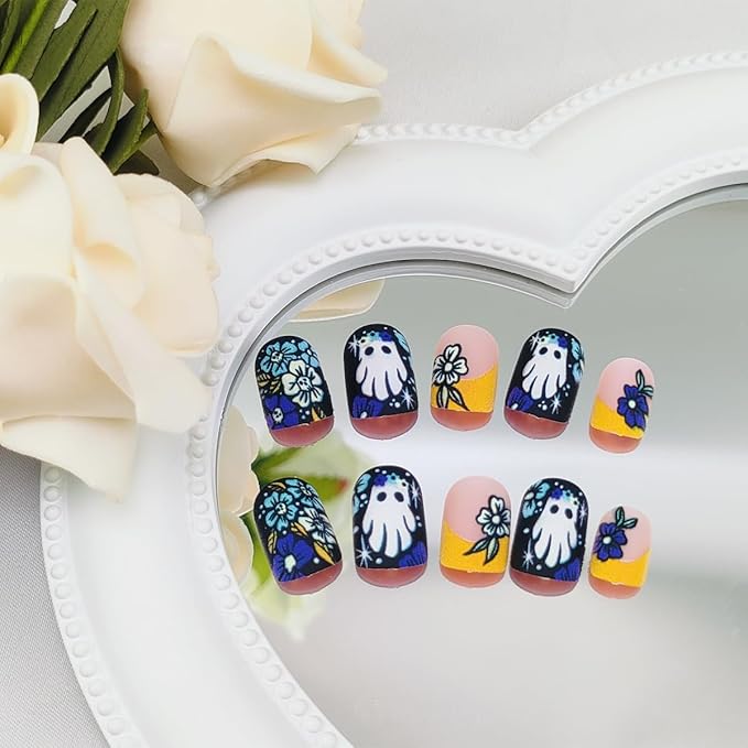 24Pcs Halloween Orange French Tip Press on Nails Short Square False Nail with Colorful Skull Flower Designs Halloween Fake Nails Cute Ghost Stick on Nail for Women DIY Manicure Decorations