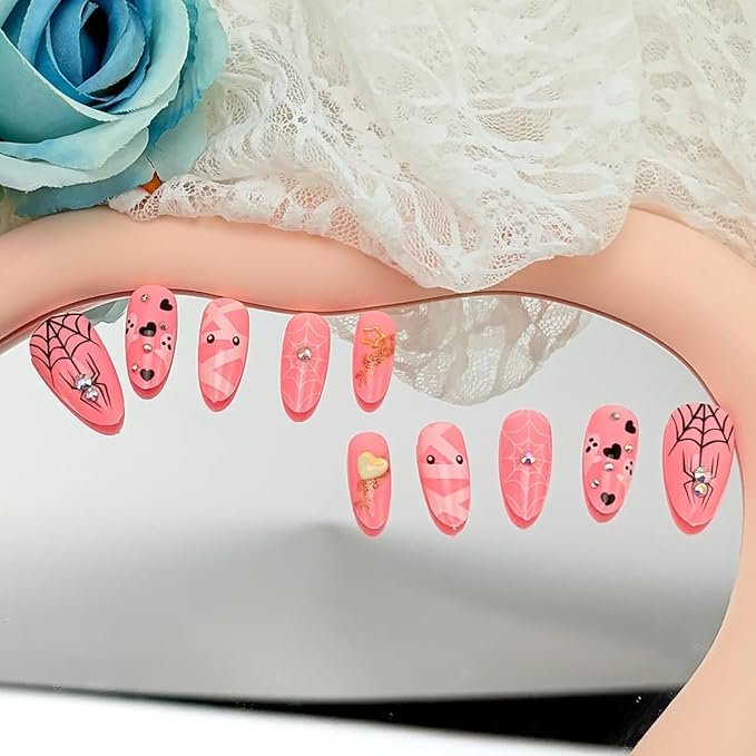 24Pcs Halloween Press on Nails Medium Almond Fake Nails with Cute Ghost Spider Web Mummy Design Pink Stick on Nails Silver Glitter Rhinestones False Nails Full Cover Artificial Glue on Nail for Women