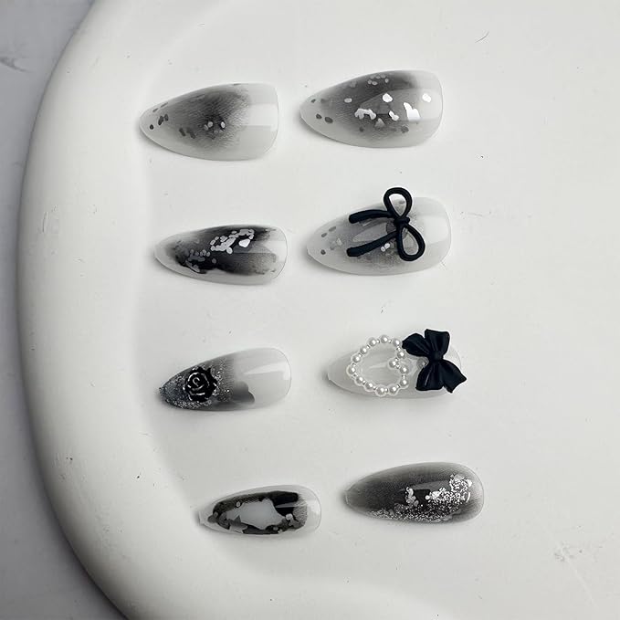 24Pcs Y2K Press on Nails Medium Almond Fake Nails with 3D Hallow Pearl Heart Bow Design Black Smudge Gothic Star Heart False Nails Alloy Retro Rose Nails Charms Stick on Nails for Women Decor