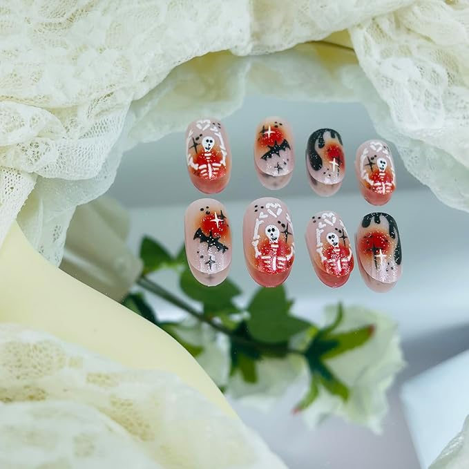 24Pcs Halloween Press on Nails Short Oval False Nail with Hand Heart Skeleton Designs Halloween Fake Nails Black Flame French Tip Nail Pumpkin Bat Glue on Nails for Women DIY Manicure Salon