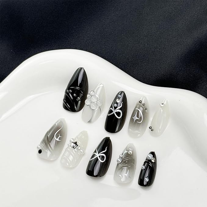 Black Press on Nails Medium Almond Fake Nails with 3D Alloy Bow Pearl Designs Black Gradient Full Cover False Nail Water Drops Silver Star Glossy Acrylic Nails Stick on Nail for Women 24Pcs