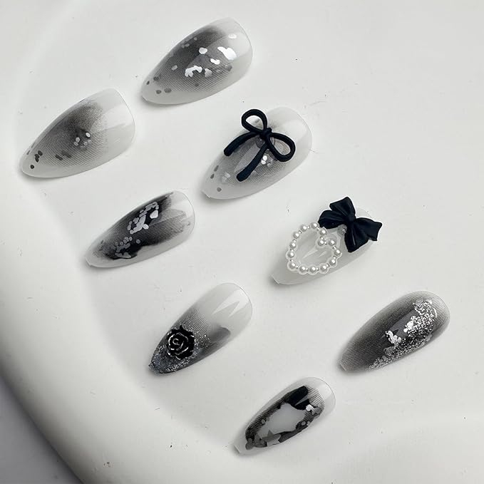 24Pcs Y2K Press on Nails Medium Almond Fake Nails with 3D Hallow Pearl Heart Bow Design Black Smudge Gothic Star Heart False Nails Alloy Retro Rose Nails Charms Stick on Nails for Women Decor