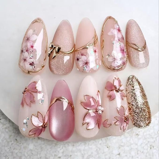 Flower Press on Nails Long Almond Fake Nails Pink Nude False Nails Peach Blossom Petals Glitter Gold Line with Rhinestone Design Pearl Glossy Glue on Nail for Women Decoration Manicure Set