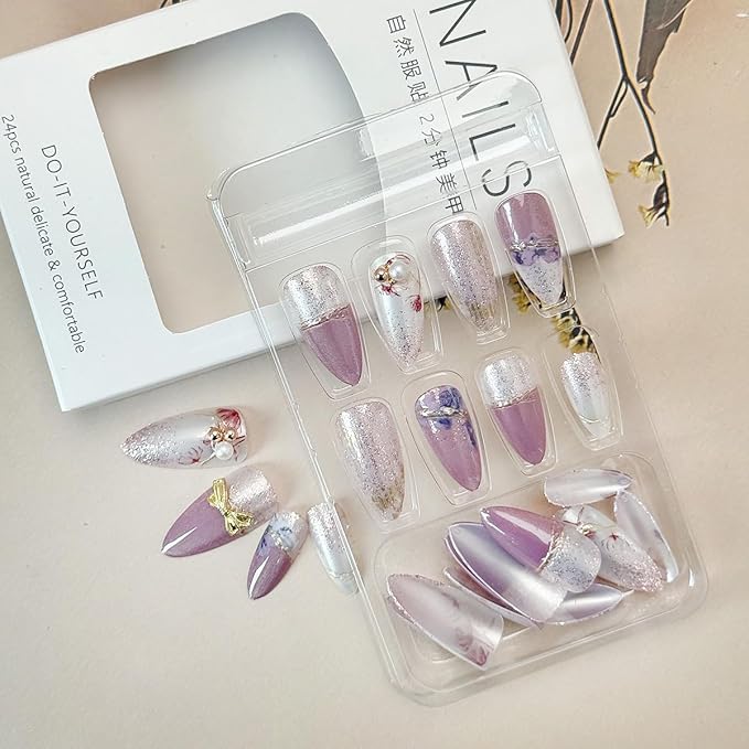 24Pcs Purple Flower Press on Nails Medium Almond Fake Nails with Pearl White Fine Sand Design Gold Bow Rhinestones False Nails Full Cover Artificial Glue on Nails Spring Stick on Nails for Women DIY