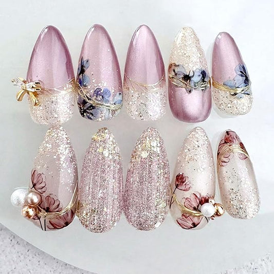 24Pcs Purple Flower Press on Nails Medium Almond Fake Nails with Pearl White Fine Sand Design Gold Bow Rhinestones False Nails Full Cover Artificial Glue on Nails Spring Stick on Nails for Women DIY