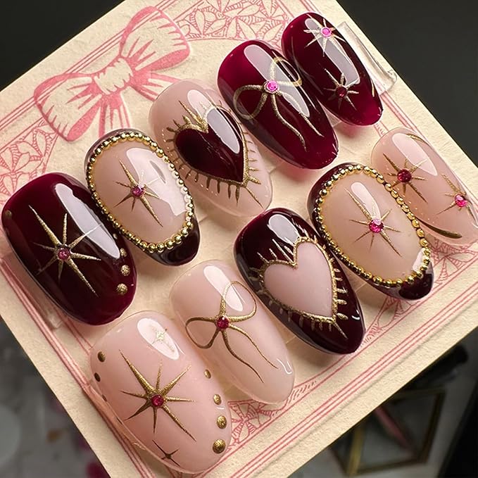 24Pcs Heart Press on Nails Medium Almond Fake Nails with Gilding Bow Star Design Glossy False Nails Nude Stick on Nails Full Cover Artificial Glue on Nails Cute Nail Supplies for Women Reusable DIY