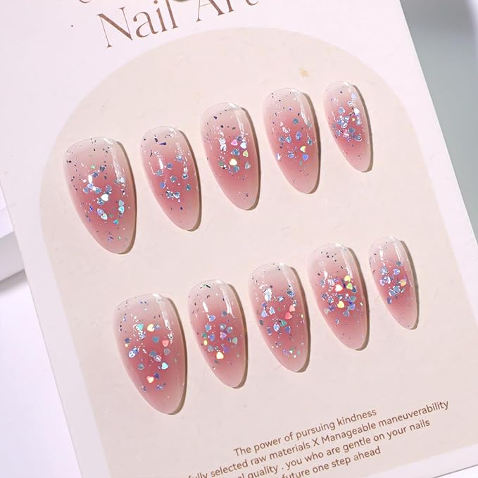 Cute Pink Glitter Press On Nails Almond Shape – Medium Length Nude Gradient Acrylic Fake Nails with Iridescent Hearts & Confetti, 24Pcs Glossy Stick On Nails Kit with Glue for Girls & Women Party
