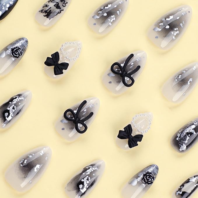 24Pcs Y2K Press on Nails Medium Almond Fake Nails with 3D Hallow Pearl Heart Bow Design Black Smudge Gothic Star Heart False Nails Alloy Retro Rose Nails Charms Stick on Nails for Women Decor