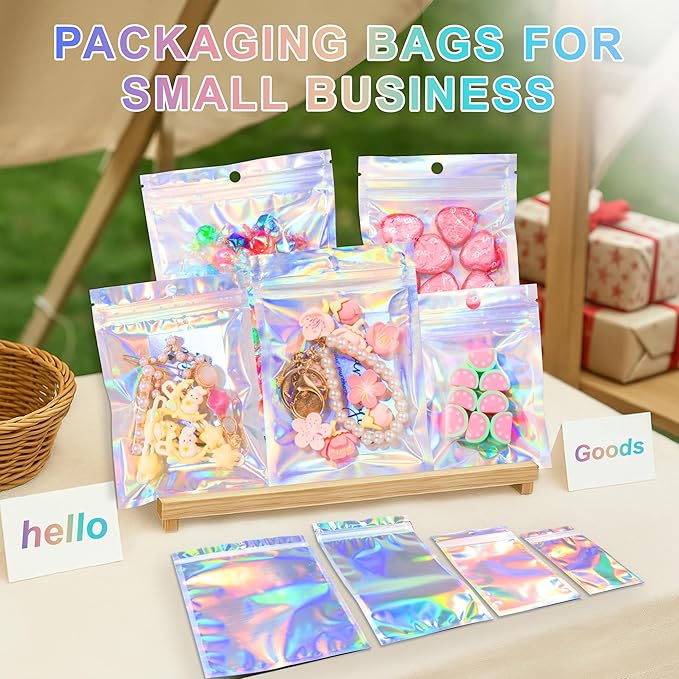 ANZNKU 100 Pack Mylar Bags Reasealable Holographic Bags, Smell Proof Bag Zipper Pouches with Clear Window, Jewelry Candy Sealable Bag for Packaging Sample Party Favor(7.1 x 10.2 Inch)