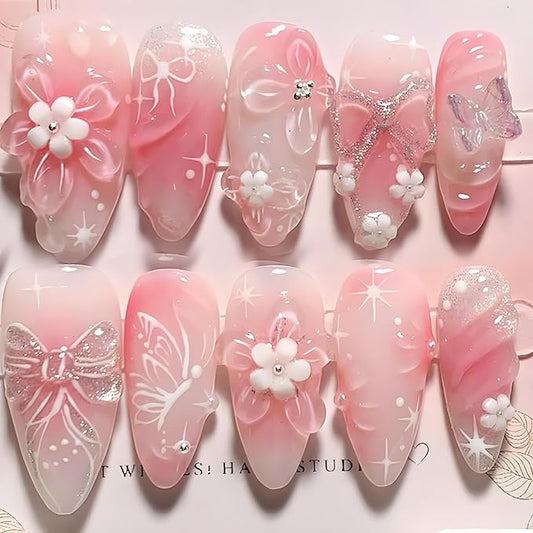 24Pcs Flower Press on Nails Medium Almond Fake Nails 3D Ripple Butterfly Floral Rhinestones Designs Glitter Stick on Nails Cute Bow False Nails Gradient Pink Glue on Nail for Women Manicure Decor
